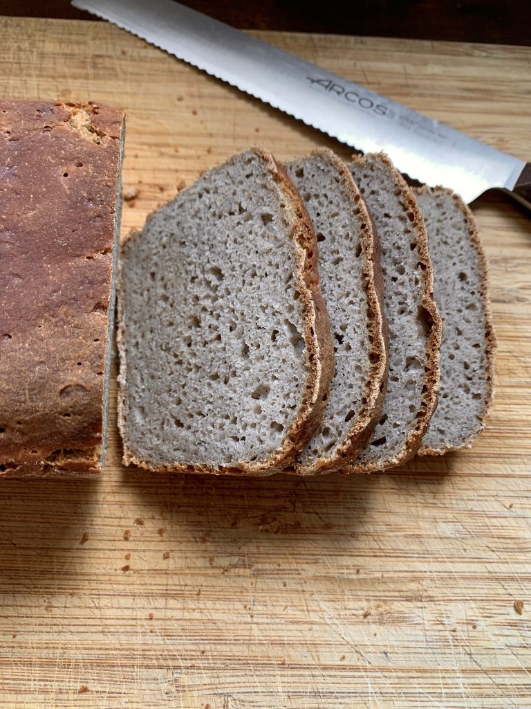 Sliced gluten free buckwheat bread on a wooden board