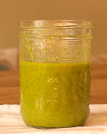 finished sweet basil dressing in a mason jar